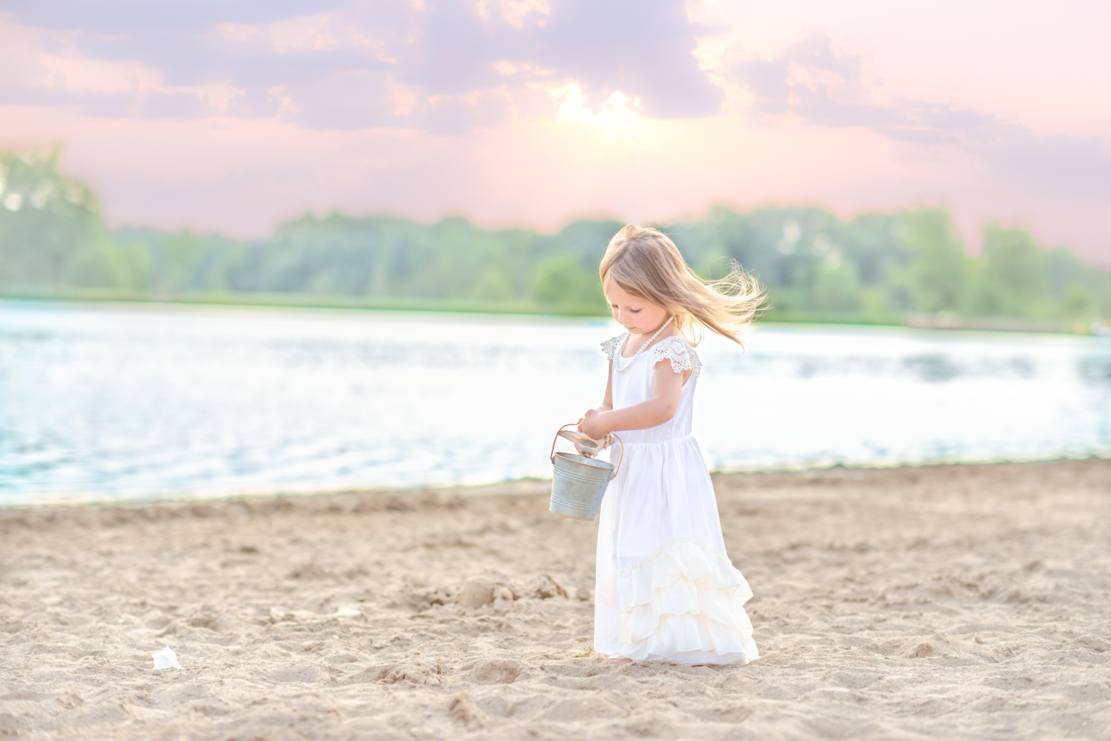 Girl walking on the beach at sunset