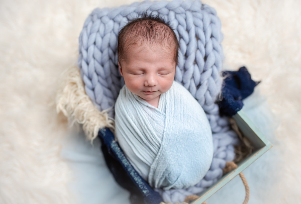 Newborn Boy in Blue Wrap